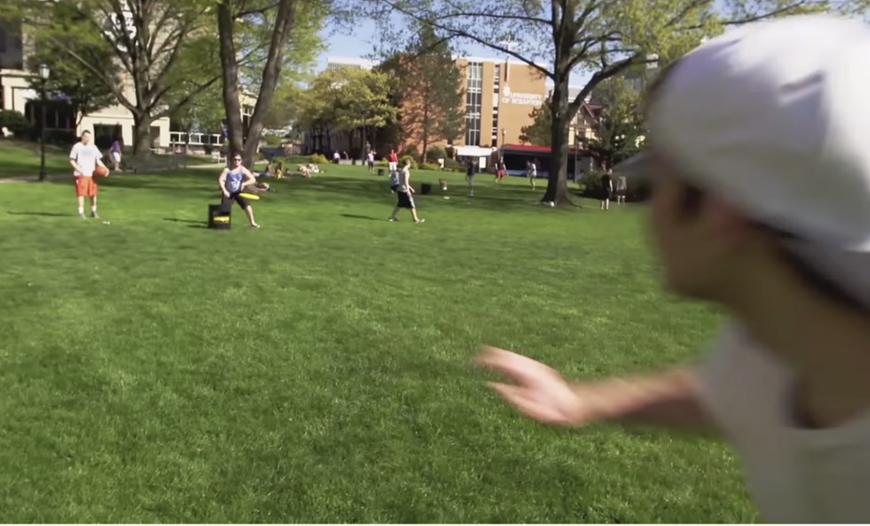 Students playing frisbee on the founder's green